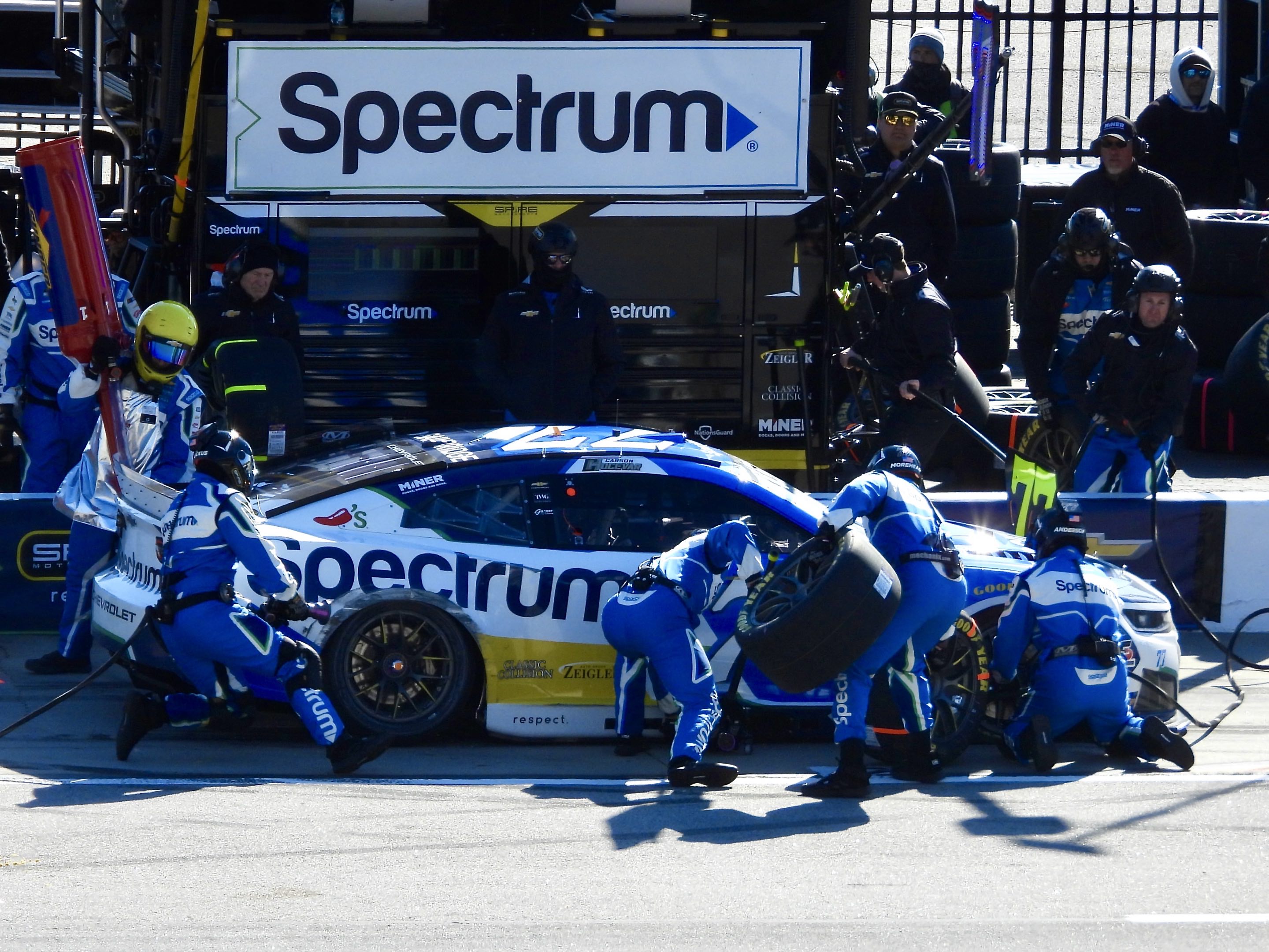 Carson Hocevar’s #77 Spectrum Chevrolet undergoes a pit stop at EchoPark Speedway in Atlanta